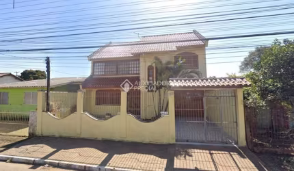 Casa em condomínio fechado com 3 quartos à venda na Rua Buttenbender, 905, Fátima, Canoas, 244 m2 por R$ 779.900