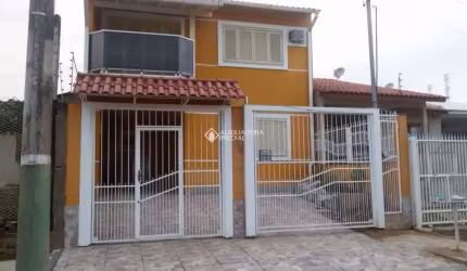 Casa com 3 quartos à venda na Rua Condores, 446, Jardim Algarve, Alvorada, 119 m2 por R$ 590.000