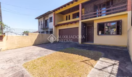 Casa em condomínio fechado com 3 quartos à venda na Avenida Ipê, 298, Vila Jardim, Porto Alegre, 192 m2 por R$ 900.000