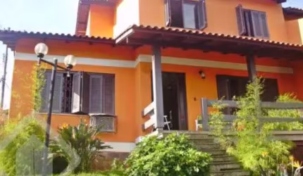 Casa em condomínio fechado com 5 quartos à venda na Rua Ângelo Passuelo, 79, Vila Nova, Porto Alegre, 215 m2 por R$ 650.000
