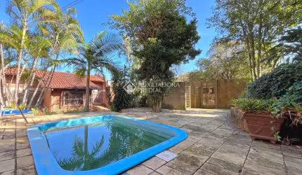 Casa com 3 quartos à venda na Rua Edgar Luiz Schneider, 490, Jardim Isabel, Porto Alegre, 350 m2 por R$ 1.290.000