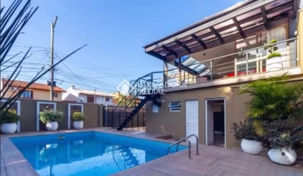 Casa com 4 quartos à venda na Rua Criciúma, 115, Guarujá, Porto Alegre, 288 m2 por R$ 1.500.000
