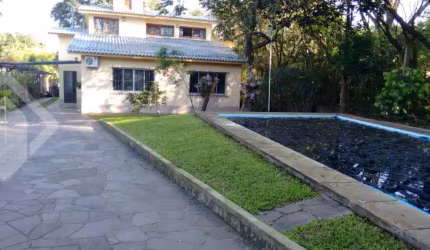 Casa em condomínio fechado com 3 quartos à venda na Rua Doutor Cecílio Monza, 10662, Belém Novo, Porto Alegre, 476 m2 por R$ 1.350.000