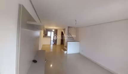 Casa em condomínio fechado com 2 quartos para alugar na Rua Corticeira, 643, Hípica, Porto Alegre, 132 m2 por R$ 3.000
