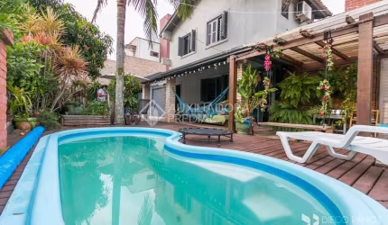 Casa em condomínio fechado com 3 quartos à venda na Estrada João Passuelo, 1060, Vila Nova, Porto Alegre, 230 m2 por R$ 520.000