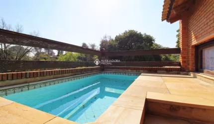 Casa em condomínio fechado com 3 quartos à venda na Rua Carlos Júlio Becker, 295, Tristeza, Porto Alegre, 331 m2 por R$ 1.100.000