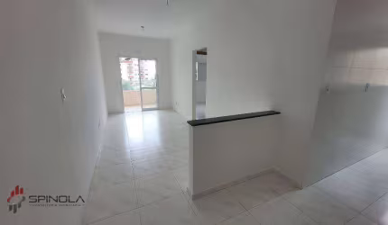 Apartamento com 2 dormitórios à venda, 52 m² por R$ 375.000,00 - Caiçara - Praia Grande/SP
