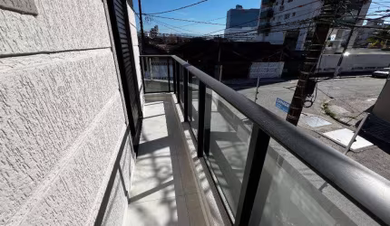 Sobrado com 3 dormitórios à venda, 127 m² por R$ 990.000,00 - Vila Guilhermina - Praia Grande/SP
