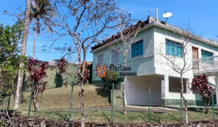 Casa com 2 dormitórios à venda, 113 m² por R$ 650.000 - Massaguaçu - Caraguatatuba/SP