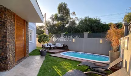 Casa com 3 quartos à venda na Rua das Angélicas, 516, Estância Velha, Canoas, 188 m2 por R$ 1.190.000