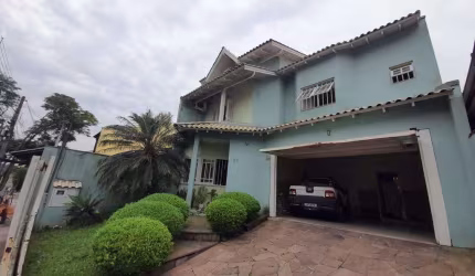 Casa com 3 quartos à venda na Rua da Amizade, 92, Estância Velha, Canoas, 197 m2 por R$ 745.000