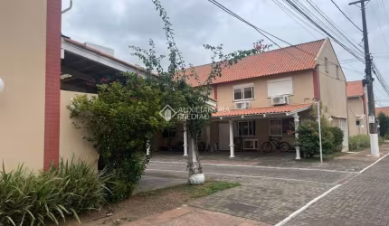 Casa em condomínio fechado com 2 quartos à venda na Rua Treze de Maio, 630, Rio Branco, Canoas, 103 m2 por R$ 280.000