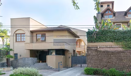 Casa de condomínio 3 dormitórios à venda no Bairro Três Figueiras com 435 m² de área privativa - 3 vagas de garagem