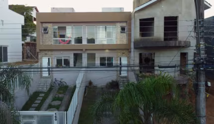 Casa de condomínio 3 dormitórios à venda no Bairro Mário Quintana com 110 m² de área privativa - 2 vagas de garagem