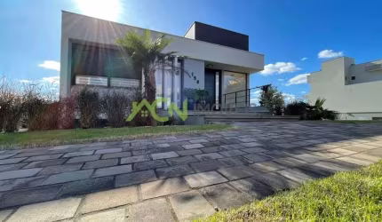 Casa com 3 suítes, mobiliada, com piscina, no Condomínio Horizon Clube, em Estância Velha.