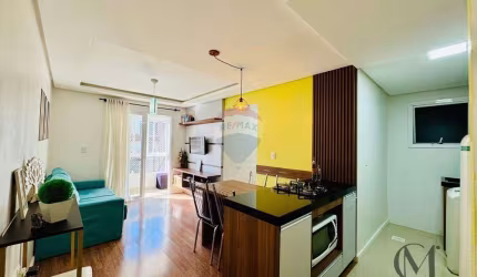 Apartamento semimobiliado com dois dormitórios e duas vagas de garagem