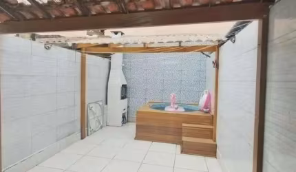 Sobrado com 3 dormitórios à venda, 97 m² por R$ 650.000,00 - Tombo - Guarujá/SP