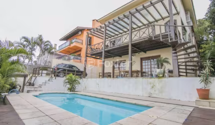 Casa com 4 quartos à venda na Rua Chiriguano, 265, Vila Assunção, Porto Alegre, 394 m2 por R$ 1.490.000