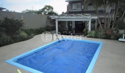 Casa com 3 quartos à venda na Rua Guarajá, 95, Jardim Botânico, Porto Alegre, 245 m2 por R$ 1.750.000