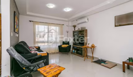 Casa em condomínio fechado com 3 quartos à venda na Rua Pau-Brasil, 263, Hípica, Porto Alegre, 155 m2 por R$ 698.000