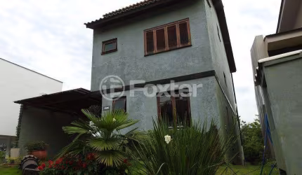 Casa em condomínio fechado com 3 quartos à venda na Avenida Senador Salgado Filho, 8500, Vila Augusta, Viamão, 238 m2 por R$ 900.000