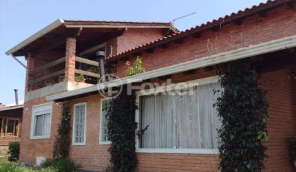 Casa em condomínio fechado com 3 quartos à venda na Estrada dos Guterres, 2565, Fiuza, Viamão, 327 m2 por R$ 550.000
