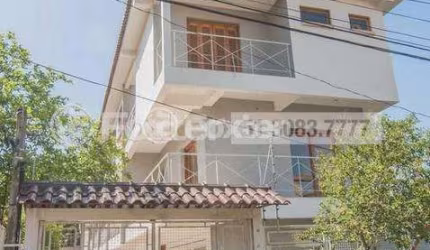Casa em condomínio fechado com 3 quartos à venda na Rua Jamil Antônio José, 46, Nonoai, Porto Alegre, 145 m2 por R$ 713.000