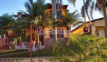 Casa com 4 quartos à venda na Rua Carazinho, 100, Cocão, Viamão, 134 m2 por R$ 500.000