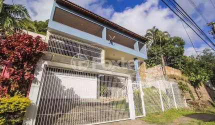 Casa com 4 quartos à venda na Rua Cleveland, 73, Santa Tereza, Porto Alegre, 287 m2 por R$ 931.000