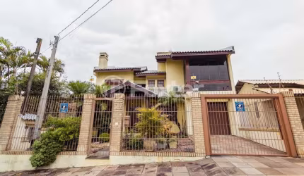 Casa com 4 quartos à venda na Travessa Porto Príncipe, 59, Jardim Lindóia, Porto Alegre, 306 m2 por R$ 1.650.000