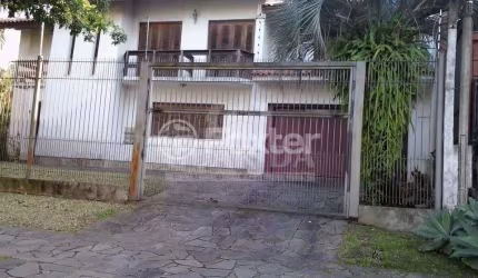 Casa com 4 quartos à venda na Rua Araponga, 6, Chácara das Pedras, Porto Alegre, 256 m2 por R$ 1.800.000