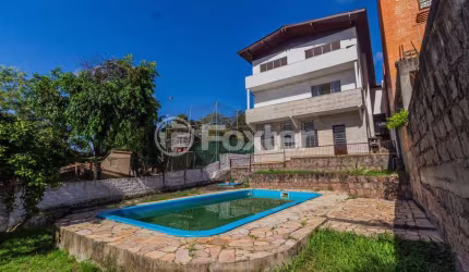 Casa com 4 quartos à venda na Praça São Caetano, 84, Teresópolis, Porto Alegre, 432 m2 por R$ 1.590.000