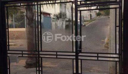 Casa com 3 quartos à venda na Rua Irmão Jaime Biazus, 43, Guarujá, Porto Alegre, 137 m2 por R$ 390.000