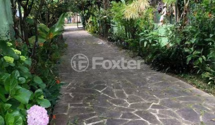 Casa com 3 quartos à venda na Avenida Ararangua, 151, Guarujá, Porto Alegre, 236 m2 por R$ 600.000