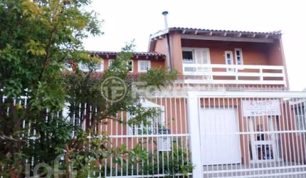 Casa com 4 quartos à venda na Rua Arroio Grande, 283, Cavalhada, Porto Alegre, 154 m2 por R$ 450.000