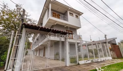 Casa em condomínio fechado com 3 quartos à venda na Rua Jamil Antônio José, 46, Nonoai, Porto Alegre, 145 m2 por R$ 560.000