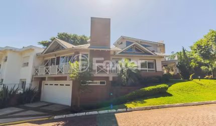 Casa em condomínio fechado com 3 quartos à venda na Rodovia Tapir Rocha, 6614, São Lucas, Viamão, 400 m2 por R$ 1.950.000