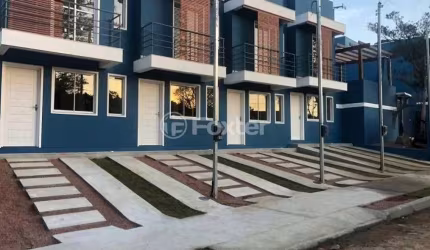 Casa em condomínio fechado com 2 quartos à venda na Rua Pero Vaz de Caminha, 177, Tarumã, Viamão, 52 m2 por R$ 220.000