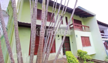 Casa com 3 quartos à venda na Rua Coronel Tisiano F. de Leoni, 305, Coronel Aparício Borges, Porto Alegre, 274 m2 por R$ 799.000