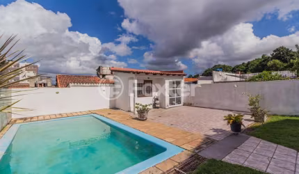 Casa com 4 quartos à venda na Rua Delfino Riet, 350, Santo Antônio, Porto Alegre, 414 m2 por R$ 1.060.000