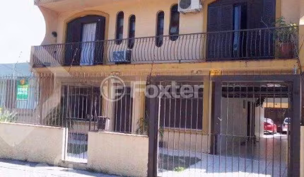 Casa com 4 quartos à venda na Rua Márcio Dias, 340, Nonoai, Porto Alegre, 450 m2 por R$ 700.000
