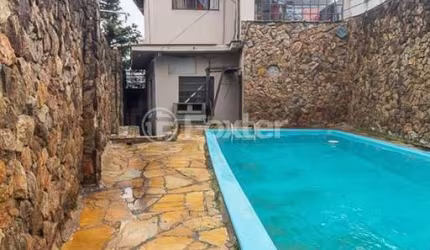 Casa com 3 quartos à venda na Avenida Mariland, 30, Auxiliadora, Porto Alegre, 190 m2 por R$ 1.200.000