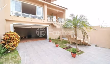 Casa com 3 quartos à venda na Rua Joaquim Cruz, 521, Santo Antônio, Porto Alegre, 316 m2 por R$ 1.149.000