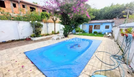 Casa com 3 quartos à venda na Rua Sebastião Wolf, 181, Nonoai, Porto Alegre, 180 m2 por R$ 870.000
