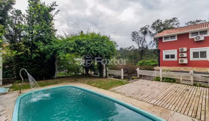 Casa em condomínio fechado com 3 quartos à venda na Rua Walter Emílio Schneider, 369, Lomba do Pinheiro, Porto Alegre, 300 m2 por R$ 940.000