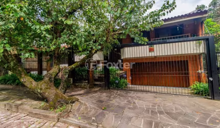 Casa com 4 quartos à venda na Rua Alcebíades Antônio dos Santos, 157, Nonoai, Porto Alegre, 362 m2 por R$ 1.650.000