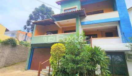 Casa com 3 quartos à venda na Rua Theonila Carvalho da Motta, 80, Parque Santa Fé, Porto Alegre, 438 m2 por R$ 1.150.000