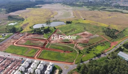 Terreno em condomínio fechado à venda na Avenida Hispânica, 495, Guajuviras, Canoas, 200 m2 por R$ 108.000