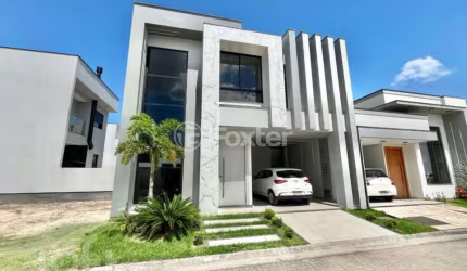 Casa em condomínio fechado com 4 quartos à venda na Avenida Deltaville, 187, Beira Rio, Biguaçu, 264 m2 por R$ 1.099.000