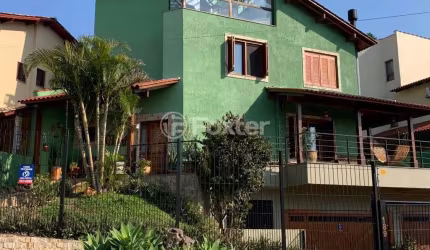 Casa com 4 quartos à venda na Rua Arachanes, 189, Espírito Santo, Porto Alegre, 303 m2 por R$ 1.250.000